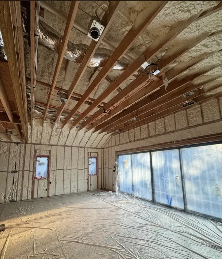 Interior walls and ceiling insulated with spray foam during new construction in Menomonie